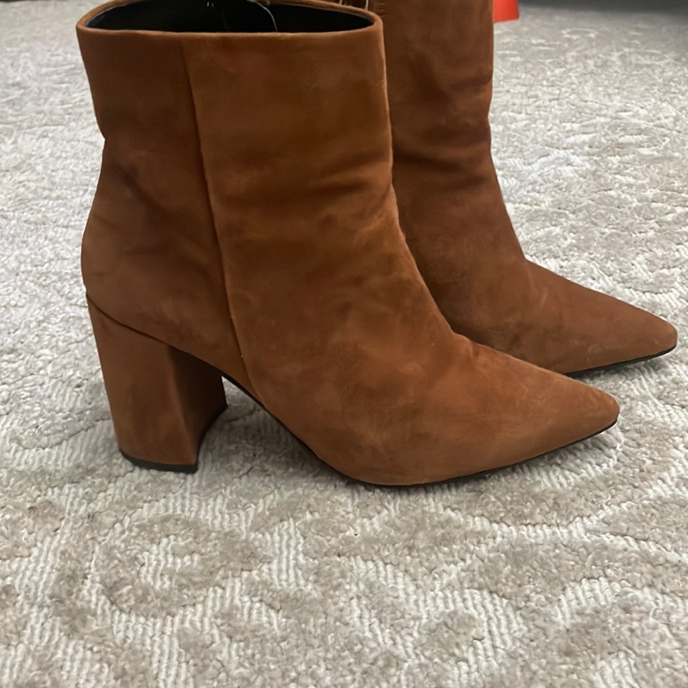 Barney’s New York Brown suede boots.